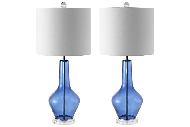 Upgrade any living room or bedroom with the clean modern curves of this contemporary table lamp. Crafted with sleek blue glass to illuminate an exquisite form, it sits on a clear acrylic base and is topped with a complementary white drum shade.Set of 2 | Made with glass and metal; 100% cotton shade | Includes 2 led a19 9w bulbs | Max. Wattage: 60w (type "a"), 13w (cfl), 9w (led) | On/off switch | 5' cord | Assembly required | Imported