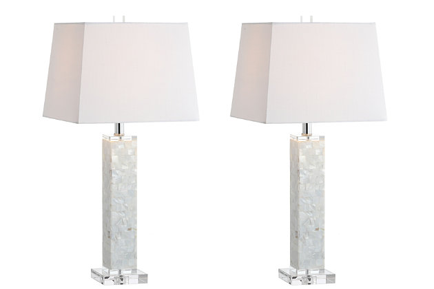 Perched atop an crystal base, this pair of seashell pillar lamps seemingly float in any space with a perfect sheen of mother-of-pearl. Hand-collected shells, polished and cut into tiles are applied in a grid mosaic on the rectangular base, and the shape of the shades mirrors that geometric motif. Accented in chrome finishing's and an crystal finial, this pair would add a beautiful sheen to a foyer, bedroom, or living space.Geometric shaped base with seashells applied in a mosaic design | 100% cotton hardback rectangle shade in white | Beautiful to display or easy to conceal: the 60" cord is silk-wrapped | On-off rotary switch on socket | Takes one bulb and compatible with any type "A" 60 watt incandescent, 13 watt CFL, or 9 watt LED | Eco-friendly 9W LED bulb included | Sleep easy knowing that all components of this piece are UL Listed, safe for your home's electrical grid | Assembly required