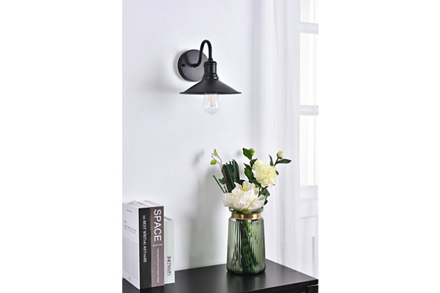 The lilting personality of the Etude wall lamp will have you singing for days. Whether the crescent arm catches your attention or its classic lampshade makes you speechless, this wall lamp will surely improve the style of any room in your home.Made of metal | Wall sconce with curved arm and circular backplate | Uses E26 bulb (sold separately) | Cone-shaped shade | Wall sconce extension: 10.2" | Dimmable | Assembly required | Imported