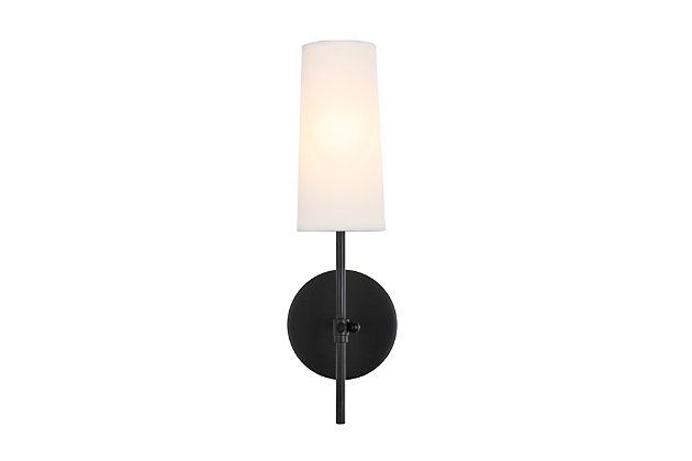 This wall lamp in the Mel Collection adds refined simplicity to your life. With an unassuming design, this versatile lamp blends in with any decor, while the sleek rod and clean linen shade add contemporary elegance and style. It brings a breath of fresh air, and is the perfect addition to your bathroom or entryway.Made of metal and fabric | Timeless design with clean lines and sleek minimalism | White linen shade | 1 light illuminates upward | Easily mounted on wall | Uses e12 bulb (sold separately); compatible with led bulbs | Dimmable | No assembly required | Imported