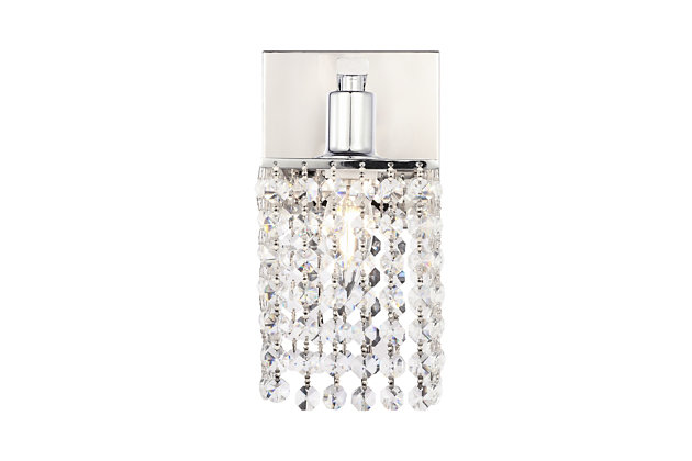 This Phineas Collection wall sconce exudes elegance and sparkling beauty. Why wouldn't it, with its beautiful curtain of clear crystal strands that shimmer with each passing second as light passes through? Your home will be illuminated and your guests will be charmed by these dancing crystal lights. And you'll be pleased with how this wall lamp can elevate any room into a luxurious and glamourous world.Made of crystal and iron | Glamourous and ritzy wall sconce sparkles with cool ease | Curtains of clear crystals | Light illuminates downwards (and is dimmable) | Uses E12 bulb (sold separately); compatible with LED bulbs | Easily mounted on wall | Assembly required | Imported
