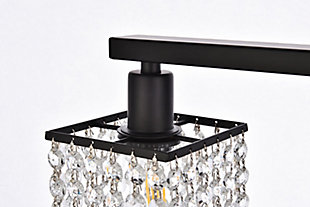 This Phineas Collection wall sconce exudes elegance and sparkling beauty. Why wouldn't it, with its beautiful curtain of clear crystal strands that shimmer with each passing second as light passes through? Your home will be illuminated and your guests will be charmed by these dancing crystal lights. And you'll be pleased with how this wall lamp can elevate any room into a luxurious and glamourous world.Made of crystal glass and iron | Glamourous and ritzy wall sconce will sparkle with cool ease | Curtains of clear crystals | 2 lights illuminate downward  | Uses E12 bulb (sold separately); compatible with LED bulbs | Easily mounted on wall | Dimmable | No assembly required | Imported