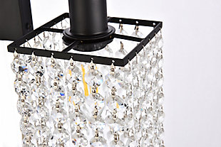This Phineas Collection wall sconce exudes elegance and sparkling beauty. Why wouldn't it, with its beautiful curtain of clear crystal strands that shimmer with each passing second as light passes through? Your home will be illuminated and your guests will be charmed by these dancing crystal lights. And you'll be pleased with how this wall lamp can elevate any room into a luxurious and glamourous world.Made of crystal glass and iron | Glamourous and ritzy wall sconce will sparkle with cool ease | Curtains of clear crystals | 2 lights illuminate downward  | Uses E12 bulb (sold separately); compatible with LED bulbs | Easily mounted on wall | Dimmable | No assembly required | Imported