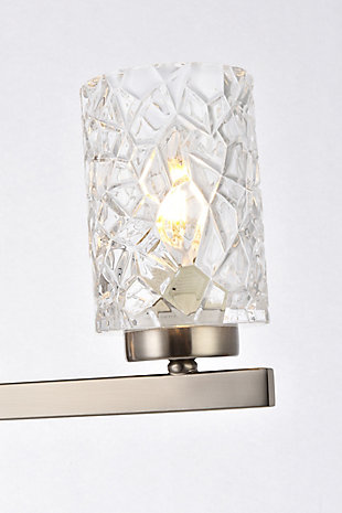 In all of its auspicious glory, the Cassie Collection wall sconce will shine its felicitous light for you. As the light passes through the shade, it dances around with the shadows and puts a spotlight in your room. Whether it's in your entryway or bathroom, this wall lamp will surely please you and your guests. Glass and metal with silvertone finish | Ideal for lighting the bathroom, hallway, and entryway | Easily mounted on the wall | Dimmable | Uses three E12 bulbs (sold separately) | No assembly required | Imported