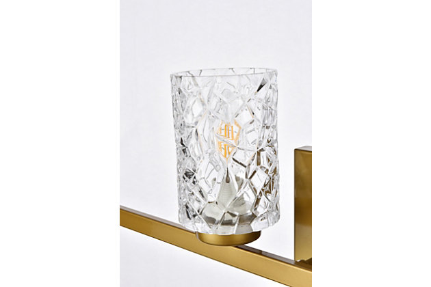 In all of its auspicious glory, the Cassie Collection wall sconce will shine its felicitous light for you. As the light passes through the shade, it dances around with the shadows and puts a spotlight in your room. Whether it's in your entryway or bathroom, this wall lamp will surely please you and your guests. Made of glass and metal | Ideal for lighting the bathroom, hallway, and entryway | Easily mounted on the wall | Dimmable | Uses four E12 bulbs (sold separately) | No assembly required | Imported