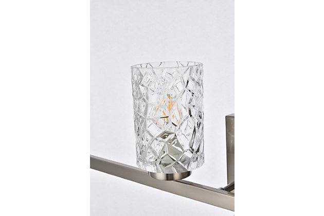 In all of its auspicious glory, the Cassie Collection wall sconce will shine its felicitous light for you. As the light passes through the shade, it dances around with the shadows and puts a spotlight in your room. Whether it's in your entryway or bathroom, this wall lamp will surely please you and your guests. Glass and metal with silvertone finish | Ideal for lighting the bathroom, hallway, and entryway | Easily mounted on the wall | Dimmable | Uses four E12 bulbs (sold separately) | No assembly required | Imported