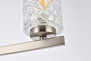 In all of its auspicious glory, the Cassie Collection wall sconce will shine its felicitous light for you. As the light passes through the shade, it dances around with the shadows and puts a spotlight in your room. Whether it's in your entryway or bathroom, this wall lamp will surely please you and your guests. Made of glass and metal | Ideal for lighting the bathroom, hallway, and entryway | Easily mounted on the wall | Dimmable | Uses five E12 bulbs (sold separately) | No assembly required | Imported