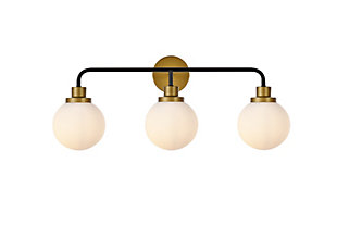 In all of its auspicious glory, the Hanson Collection wall lamp will shine its felicitous light for you. As the light passes through the shade, it dances around with the shadows and puts a spotlight in your room. Whether it's in your entryway or bathroom, this wall lamp will surely please you and your guests. Made of glass and metal | Ideal for lighting the bathroom, hallway, and entryway | Easily mounted on the wall | Dimmable | Uses three E12 bulbs (sold separately) | No assembly required | Imported