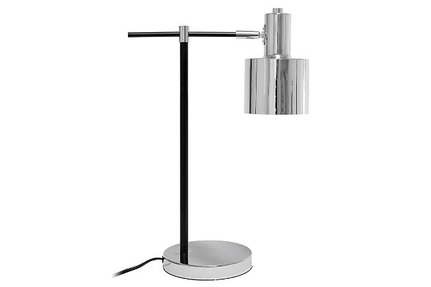 Illuminate your living space with this simple yet bold table lamp. It features a beautiful polished chrome finish with black accents. The perfect accent piece for your office, bedroom, foyer or living room.Polished chrome finish | Round metal shade | Modern and industrial | (1) 40w type a medium base bulb (not included) required | Easily accessible on/off switch on cord | 5 foot black cord