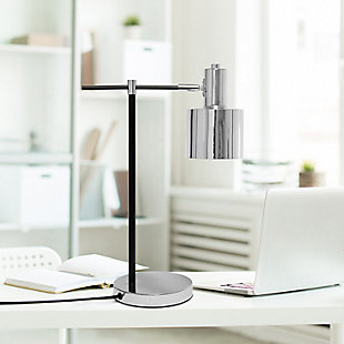Illuminate your living space with this simple yet bold table lamp. It features a beautiful polished chrome finish with black accents. The perfect accent piece for your office, bedroom, foyer or living room.Polished chrome finish | Round metal shade | Modern and industrial | (1) 40w type a medium base bulb (not included) required | Easily accessible on/off switch on cord | 5 foot black cord