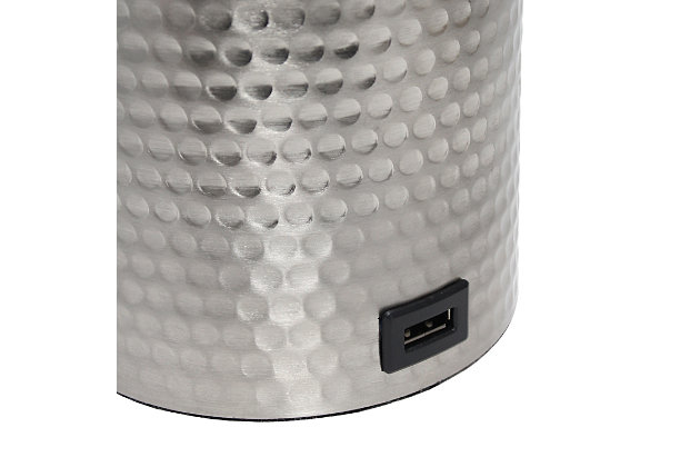 This fun and fashionable lamp features a brushed nickel hammered metal base and a white fabric shade. It comes equipped with a USB seated in the base for charging mobile phones, handheld games, tablets, and other small electronics. This lamp will add a fabulous flair to any room. Perfect for bedrooms, kids and teens, college dorms, nurseries, or fun offices.Brushed nickel base with usb charging port on base | White fabric shade | Perfect for bedrooms, kids room, college dorm, nursery, or fun office | Uses (1) 40w type a medium base bulb (not included) | Usb port on base for charging your phone or other device | Base includes storage for supplies