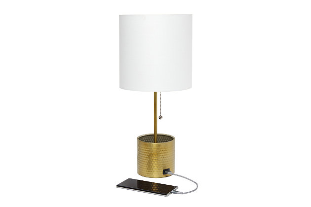 This fun and fashionable lamp features a gold hammered metal base and a white fabric shade. It comes equipped with a USB seated in the base for charging mobile phones, handheld games, tablets, and other small electronics. This lamp will add a fabulous flair to any room. Perfect for bedrooms, kids and teens, college dorms, nurseries, or fun offices.Gold base with usb charging port on base | White fabric shade | Perfect for bedrooms, kids room, college dorm, nursery, or fun office | Uses (1) 40w type a medium base bulb (not included) | Usb port on base for charging your phone or other device | Base includes storage for supplies
