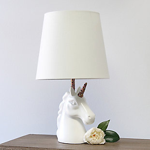 Add a touch of personality to your decor with this fun unicorn lamp. With a white resin base and touches of shimmering rainbow glitter, this lamp is sure to illuminate any room in style. Perfect for bedrooms, kids and teens, college dorms or nurseries.White and rainbow glitter resin base | White tapered fabric shade | Unicorn's horn and neck of lamp coated in shimmering rainbow glitter | Uses (1) 40w type a medium base bulb (not included) | Easily accessible rotary switch located on the cord