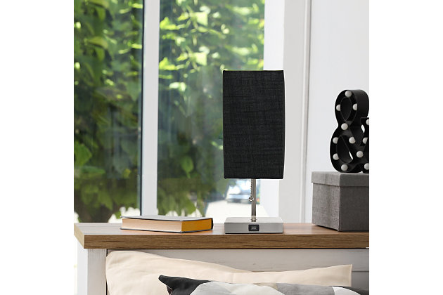 Simple yet fun, this fashionable table lamp features a brushed nickel base and a fabric shade. It comes equipped with a USB seated in the base for charging mobile phones, handheld games, tablets, and other small electronics. This lamp will add a fabulous flair to any room. Perfect for bedrooms, kids and teens, college dorms, nurseries, or fun offices.Brushed nickel base with usb charging port on base | Rectangular fabric shade | Perfect for bedrooms, kids room, college dorm, nursery, or fun office | Uses (1) 40w type a medium base bulb (not included) | Usb port on base for charging your phone or other devices | Lamp is a mini lamp; please see details for height