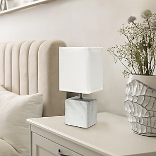 Sleek and sophisticated, this chic table lamp is perfect for adding a little style to any room. Crafted from ceramic, this design features an elegant marble-like construction in its bold square base. Perfect for bedrooms, entryways, kids and teens, college dorms, nurseries, or offices.White faux marble base | White rectangular fabric shade | Trendy faux marble look | Uses (1) 40w type b e-12 candelabra base bulb (not included) | Easily accessible rotary switch located on the cord | Lamp is a mini lamp; please see details for height