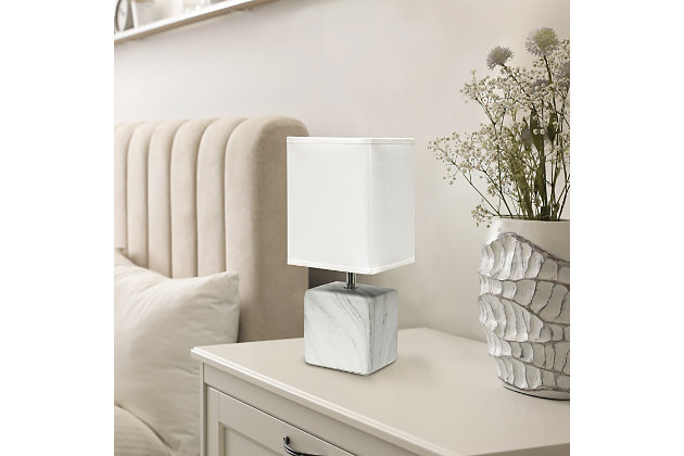 Sleek and sophisticated, this chic table lamp is perfect for adding a little style to any room. Crafted from ceramic, this design features an elegant marble-like construction in its bold square base. Perfect for bedrooms, entryways, kids and teens, college dorms, nurseries, or offices.White faux marble base | White rectangular fabric shade | Trendy faux marble look | Uses (1) 40w type b e-12 candelabra base bulb (not included) | Easily accessible rotary switch located on the cord | Lamp is a mini lamp; please see details for height