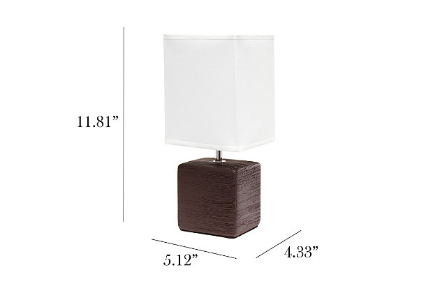 Clean and modern, this simple table lamp features a square faux stone base crafted from ceramic. The crisp, soft fabric shade adds a gentle touch to the textured base. Perfect for bedrooms, entryways, kids and teens, college dorms, nurseries, or offices.Brown faux stone base | White rectangular fabric shade | Trendy faux stone look | Uses (1) 40w type b e-12 candelabra base bulb (not included) | Easily accessible rotary switch located on the cord | Lamp is a mini lamp; please see details for height