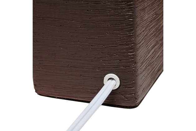 Clean and modern, this simple table lamp features a square faux stone base crafted from ceramic. The crisp, soft fabric shade adds a gentle touch to the textured base. Perfect for bedrooms, entryways, kids and teens, college dorms, nurseries, or offices.Brown faux stone base | White rectangular fabric shade | Trendy faux stone look | Uses (1) 40w type b e-12 candelabra base bulb (not included) | Easily accessible rotary switch located on the cord | Lamp is a mini lamp; please see details for height