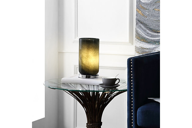 Designed to be an art piece whether turned on or off, this table lamp is a mesmerizing focal point in any decor. The gray textured glass gives a captivating shine, while its chrome pedestal base balances the look for today’s contemporary chic homes. Add this light to an accent table to create a soothing, relaxing ambiance among your decorMade of metal with glass cylinder shade | Gray textured glass | Base with polished chrome-tone finish | On/off switch | Uses single 4-watt led bulb (included) | 60" power cord; ul listed | Indoor use only | Assembly required | Imported