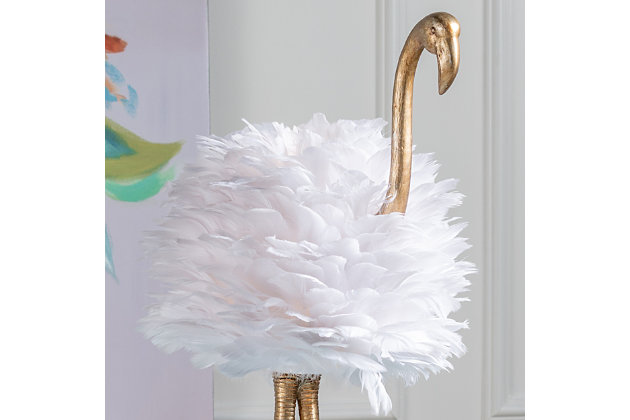 Fabulous and fashionable, this flamingo lamp will grab glances from everyone who sets foot in your home. A textured goldtone finish adorns the body, with a cluster of faux feathers operating as the shade and bird's body. It's sure to make a striking statement in your living room or bedroom.Made of resin with oval hardback faux feather shade | Goldtone finish | In-line switch | 1 E26 socket; type A bulb recommended (not included); 60-watt max | Non-skid bottom | Power cord included; UL Listed | Assembly required