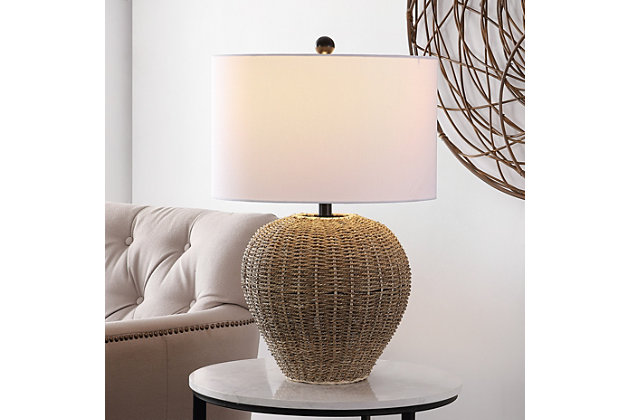 The Firth table lamp proves that anything rattan is effortlessly stylish. The organic woven texture of its brown rattan body emanate rich tropical vibes, beautifully offset by the crisp, clean lines of a white drum shade.Made of metal | Shade material: 100% cotton | Bulb type included: LED A19 9W | Max. wattage: 100 | Watt: 9W | Lumen: 805 | Qty of bulbs: 1 | Lighting switch type: ON/OFF | Lamp certification: UL | Assembly required | Imported