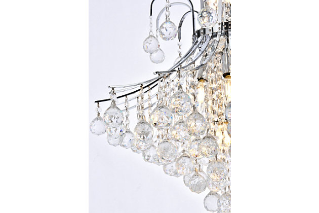A treasure trove of glittering crystals, Toureg collection pendant lamps are generous with their sparkle. Stately curved steel arms and frame form an opulent flared shape available in chrome or gold finishes. Faceted clear crystal balls and crystal octagons offer a variety of options to choose from. Certain to be the center of attention in the dining room, living room, bedroom, or stairwell. Flared shape and curved steel arms, frame, and chain in a chrome finish  | Clear faceted crystal balls and royal-cut crystal octagons  | Lamp features a diameter of 25 inches, a height of 31 inches, and requires 15 candelabra bulbs | comes with a 60 inch long hanging chain