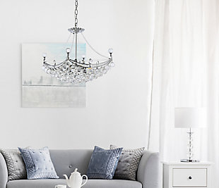 An empire-style chandelier brimming with sparkle, Corona collection hanging fixtures fill a home with brilliant light. The base of the frame forms a hemisphere that is overflowing with clear crystal balls and faceted prisms and tipped with matching crystal balls. Draped crystal octagon strands dangle along the body of the lamp while a gorgeous crystal “crown” matches the edges of the frame, completing the look and giving the design its name. Available in one, two, or three glorious tiers a chrome or gold finish that is dazzling in a dining room, stairwell, or living room.Room use: Dining room; Living room; Bedroom; Bathroom; Entry Way; Closet | Diameter of 24 inches; minimum hanging height of 24 inches, maximum hanging height of 78 inches. | Warm, brilliant light is created by 6 light bulbs. (not included) | comes with a 60 inch long hanging chain