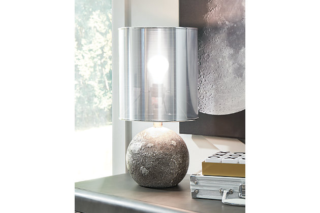 Style meets function with the Kadian accent lamp. With just a simple switch of the lamp you can illuminate spaces with soft ambient light. This is the ideal size for nightstands or where space may be limited.Made of polyresin with plastic metallic silvertone drum shade | Antiqued gray finish | On/off switch | 1 type A bulb (not included), 60 watts max or CFL 13 watts max; UL Listed | Minor assembly required | Estimated Assembly Time: 15 Minutes