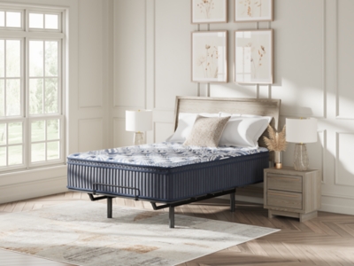 angled view of bed showing mattress and base