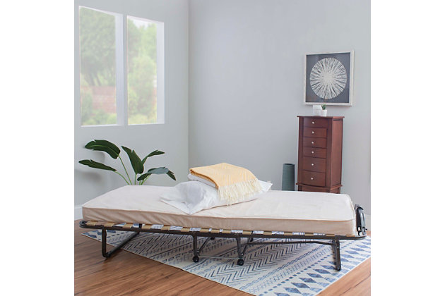 Unexpected guests? No problem when you have the Luxor ultimate folding bed with memory foam mattress on hand. Small enough to store in a closet, the bed sets up in seconds. Casters offer portability while the memory foam mattress offers your guest comfort. Wood slats and the metal tube frame provide lasting durability.Includes steel frame and mattress | Mattress is topped with a layer of memory foam with beige damask fabric cover | Casters for easy mobility | Metal tube frame with wood slat supports