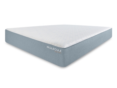 Close-up of a memory foam mattress with a light blue side and MOLECULE logo