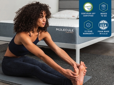 Person doing stretches on a mattress with MOLECULE branding