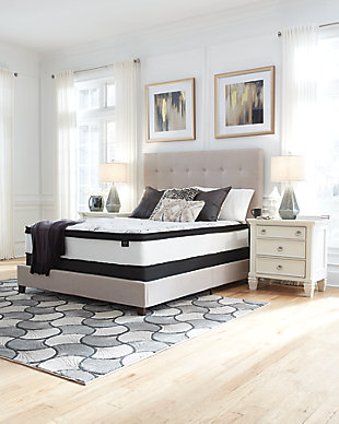 Serenity now. The Dolante queen upholstered bed and our Chime 12-inch hybrid innerspring mattress are sure to awaken a love for modern platform styling with a softer side. Plush to the touch and so easy on the eyes, a pale beige fabric hugs the bed—from the chic headboard with square button tufting, to the low footboard and side rails, emanating the calming mood you long for in the bedroom. With the mattress included, you'll get the support of a truly traditional coil mattress which contours to your body for a comforting feel. High density foam provides the firmness you love. Gel memory foam provides restorative support for your lower back. Hypoallergenic material is ideal for sufferers of allergies for ultimate undisturbed sleep—not to mention peace of mind. Plus, this mattress arrives in a box for quick and easy setup. Simply bring it to your room, remove the plastic wrap and unroll. You’ll be amazed at how it fully expands within minutes. Foundation/box spring available, sold separately.Hypoallergenic: made from materials that don’t trigger allergies | Includes mattress and bed | Bed with engineered wood frame, headboard, footboard and rails | Square button tufting on headboard | Polyester upholstery on headboard, footboard and rails | Mattress comfort level: ultra plush | High density gel memory lumbar support foam and super soft quilt foam | Upholstery grade comfort support foam | 680 Individual power packed wrapped coils | 2 perimeter rows of 9" 13-gauge pocketed coils | 10-year non-prorated warranty, adjustable base compatible | CertiPur-US certified | State recycling fee may apply | Note: Purchasing mattress and foundation from two different brands may void warranty; check warranty for details | Foundation/box spring available, sold separately | Assembly required