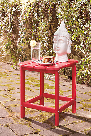 Add cottage-quaint charm to your outdoor oasis with the Sundown Treasure outdoor end table in red.  Made of MEGA TUFF™ high-density polyethylene material, it’s sure to weather the seasons beautifully. Designed to shed rainwater, the table’s slatted top with gently rounded corners provides exceptional form and function.Made of durable and sturdy HDPE high-density polyethylene red material | MEGA TUFF™ HDPE surfaces are made of high-density polyethylene, which gives the wood look you love and the weather resistance you crave | Stainless steel hardware | Designed to withstand the harsh elements of the outdoors | Slatted design | Assembly required | Estimated Assembly Time: 15 Minutes