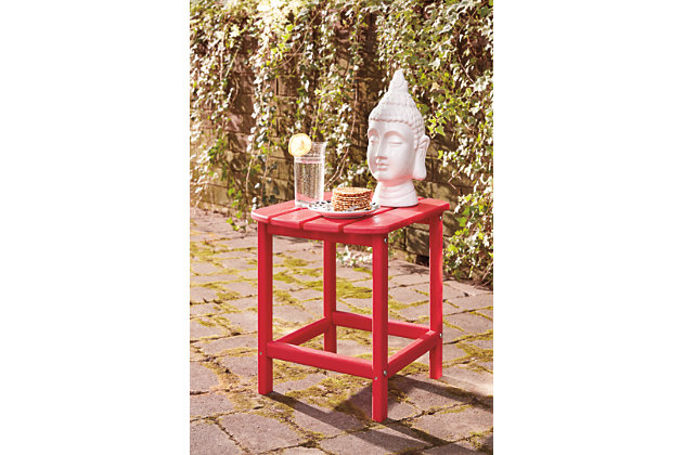 Add cottage-quaint charm to your outdoor oasis with the Sundown Treasure outdoor end table in red.  Made of MEGA TUFF™ high-density polyethylene material, it’s sure to weather the seasons beautifully. Designed to shed rainwater, the table’s slatted top with gently rounded corners provides exceptional form and function.Made of durable and sturdy HDPE high-density polyethylene red material | MEGA TUFF™ HDPE surfaces are made of high-density polyethylene, which gives the wood look you love and the weather resistance you crave | Stainless steel hardware | Designed to withstand the harsh elements of the outdoors | Slatted design | Assembly required | Estimated Assembly Time: 15 Minutes