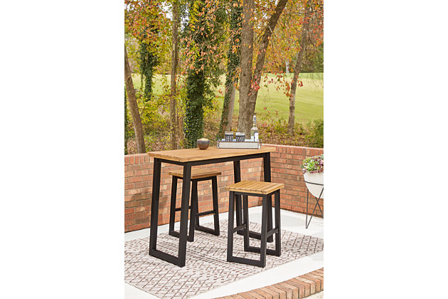Bring an uptown feel to an outdoor space with the Town Wood outdoor furniture set. An especially smart choice for small spaces, this ultra-cool counter height outdoor table and bar stool set a new standard in outdoor living. The tabletop and seats are richly crafted of acacia wood with wonderful tonal variation. Tubular steel legs are sleek, sturdy and slightly canted for an interesting angled effect.Includes counter height table and 2 counter height bar stools | Tabletop and seats made of acacia wood with slatted styling | Stainless steel hardware | Steel legs and table base in powder coated black finish | Assembly required | Estimated Assembly Time: 45 Minutes
