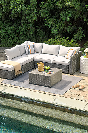 Turn your outdoor space into a sweet retreat with the Cherry Point 4-piece outdoor sectional. High style crafted for low-maintenance living, this decidedly clean and contemporary outdoor furniture set entices in an easy-breezy gray resin wicker over a rust-free aluminum frame for an upscale aesthetic that’s downright durable. Wrapped in high-performing Nuvella® fabric, the plush cushions are indulgently comfortable yet so carefree.Includes sectional (with loveseat/ottoman) and coffee table | All-weather resin wicker handwoven over rust-free aluminum frame | Resin wood-look tabletop | Zippered cushions covered in high-performing Nuvella® fabric | All-weather foam cushion core wrapped in soft polyester | Imported fabric and fill | Includes 2 throw pillows | Clean fabric with mild soap and water, let air dry; for stubborn stains, use a solution of 1 cup bleach to 1 gallon water | Assembly required | Estimated Assembly Time: 30 Minutes