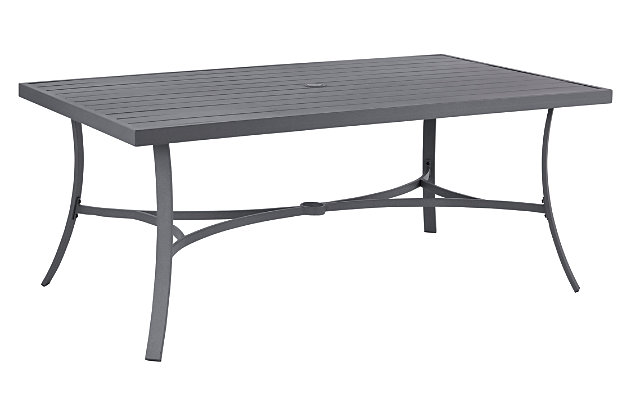 The Donnalee Bay outdoor dining table with umbrella hole serves it up right with a trendy, textural gray finish that’s decidedly modern. Sturdy, rust-proof aluminum is sure to weather the seasons beautifully. Crafted for rainwater runoff, the slat-style top is as pretty as it is practical.Accommodates 6, swivel dining chairs sold separately | All-weather, rust-proof aluminum frame with textured gray finish | Slat-style tabletop | Umbrella hole; cap included | Assembly required