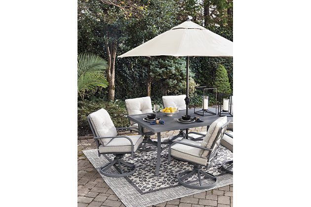 The Donnalee Bay outdoor dining table with umbrella hole serves it up right with a trendy, textural gray finish that’s decidedly modern. Sturdy, rust-proof aluminum is sure to weather the seasons beautifully. Crafted for rainwater runoff, the slat-style top is as pretty as it is practical.Accommodates 6, swivel dining chairs sold separately | All-weather, rust-proof aluminum frame with textured gray finish | Slat-style tabletop | Umbrella hole; cap included | Assembly required