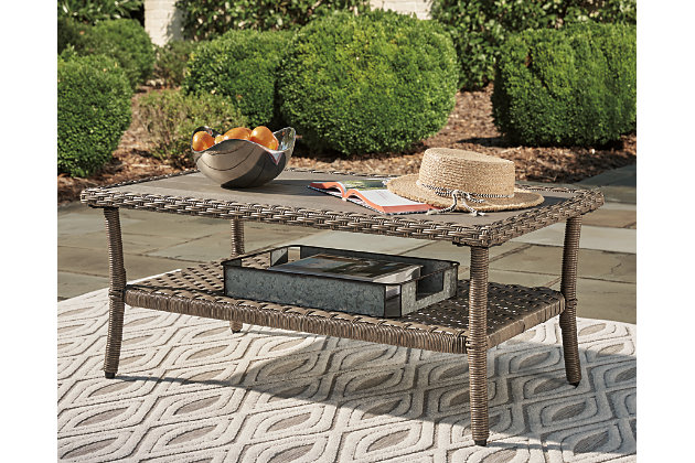 Clearly for those with exceptionally good taste, the Clear Ridge outdoor cocktail table revisits the past, but with today’s low-maintenance approach in mind. Modeled after classic “front porch” wicker furniture, this high-style outdoor table includes a rust-free aluminum frame beautified with an all-weather resin weave for authentic flair—but with easy care!All-weather resin wicker handwoven over rust-free aluminum frame | Wood-look resin top with plank effect | Light brown tone | Fixed shelf | Assembly required | Estimated Assembly Time: 30 Minutes