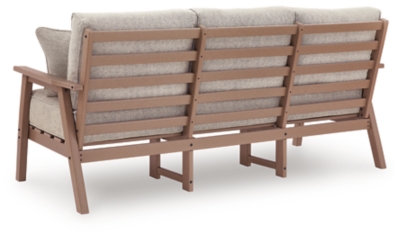 Back view of a brown wooden outdoor sofa frame with slats and metal connectors