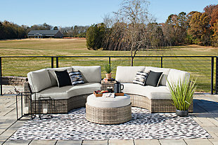 The cool, casual Calworth outdoor sectional will raise the comfort level and visual appeal of your outdoor living space. Made with handwoven wicker in easy-going beige tones, the curved loveseat and ottoman blend beautifully into your lanai or pool and patio area. Thick, comfy cushions are wrapped in Nuvella high-performance beige fabric that is stain-resistant, fade-resistant, and easy to clean. A console with cup holders allows you to have a backup beverage handy. Throw pillows are included for added comfort and a splash of color. This sectional creates a space that holds up to Mother Nature and ages gracefully for years of enjoyment.Includes 2 curved loveseats, ottoman and console | All-weather resin wicker handwoven over rust-free aluminum frame with durable powder coated finish; powder coated aluminum resists rusting and fading | Nuvella (solution-dyed polyester) high-performance beige fabric | Stainless steel hardware | Designed to withstand the harsh elements of the outdoors | Loveseat with loose, reversible cushions; firmly cushioned ottoman | All-weather foam cushion core wrapped in soft polyester | Clean fabric with mild soap and water, let air dry; for stubborn stains, use a solution of 1 cup bleach to 1 gallon water | Console with 2 cup holders | Throw pillows included | Imported fabric and fill | Assembly required | Estimated Assembly Time: 100 Minutes