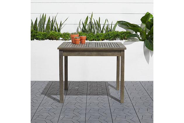 Bring friends and family together with the Renaissance outdoor dining table. Quality crafted from 100% acacia hardwood, it’s made to stand up to weather conditions and resist decay. Clean-lined profile and hand-scraped gray finish bring an easy-elegant look to any patio or garden. Includes slatted top to shed rainwater and umbrella hole.Made of acacia wood | Gray/hand-scraped/weathered finish | Slatted top | Umbrella hole | Resistant to mold, mildew, fungi, termites rot and decay | Easy assembly