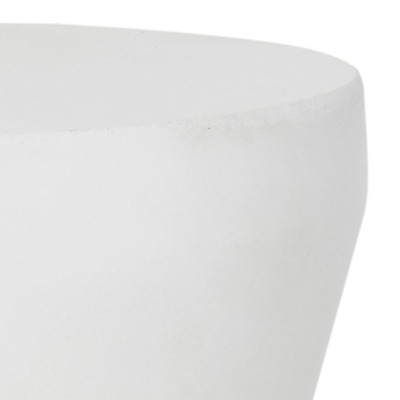 Close-up of white material edge of cylindrical table