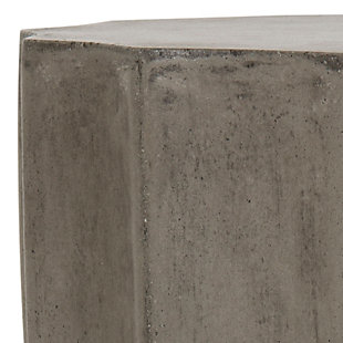 An exhibition of antiquity’s architectural marvels at the world’s top encyclopedic museum inspired this contemporary concrete accent table. Its nuanced design and dark gray hue highlight the symmetric ideal defining beauty in the ancient and modern worlds. Perfect for indoor and outdoor use.Made of concrete | Suitable for indoor/outdoor use | Spills should be taken care of immediately before they stain; do not use bleach solutions | Weight capacity 175 lbs