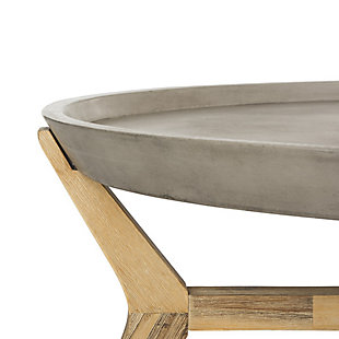 Inspired by the iconic furnishings in Spain’s top design gallery, this concrete oval indoor-outdoor coffee table is an investment. Crafted with acacia wood, its natural finish and dark gray top instantly upgrade any living room or outdoor space.Made of acacia wood and concrete | Suitable for indoor/outdoor use | Spills should be taken care of immediately before they stain; do not use bleach solutions | Weight capacity 15 lbs | Assembly required