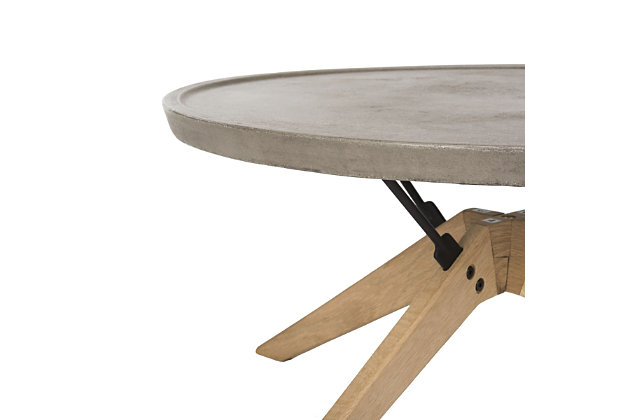 Designed to make a grand statement, this concrete round indoor-outdoor coffee table lends industrial luxe style to any contemporary space. Crafted with a natural oak finish and a dark gray hue, it’s ideal for the living room or outdoor entertaining area.Made of oak wood, steel and concrete | Suitable for indoor/outdoor use | Spills should be taken care of immediately before they stain; do not use bleach solutions | Weight capacity 15 lbs | Assembly required