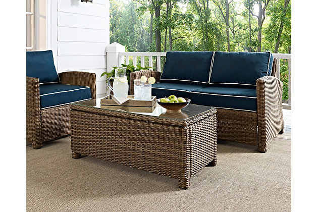 Outdoor entertaining is a breeze with this outdoor coffee table. Finely crafted with intricately woven resin wicker over a durable steel frame, this timeless wicker coffee table provides lasting convenience and style. Tempered glass top offers a smooth surface that simply makes easy.Durable powdercoated steel frame | All-weather resin wicker with rattan look | Tempered glass top | Assembly required