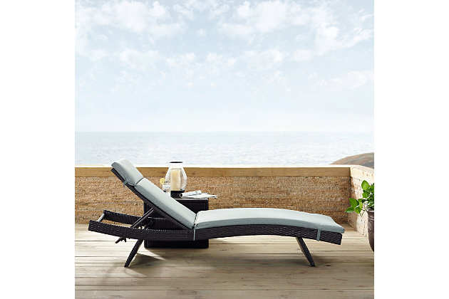 Here it is. Your relaxation destination. This outdoor lounger featuring a sleek, curved silhouette delivers contemporary appeal and smoothly reclines for maximizing comfort. The thickly padded cushions provide a luxurious look and feel, while the tightly woven, dark brown faux rattan gives it a rich and fashionable look. Whether you want to kick back by the pool or unwind in your backyard on a sunny day, this lovely lounger is a must-have addition to your outdoor space.Made of steel, resin wicker and polyester | Brown faux rattan over steel powdercoat frame | Uv/fade resistant | Mist green polyester cushions | Moisture resistent, high-grade cushion core | Assembly required
