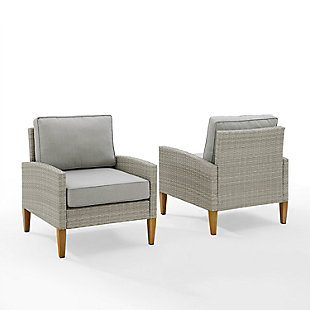 Prepare to lounge and chat away in this highly stylish chair set. Blending cool neutral tones with natural finishes provides a chic upgrade to your outdoor space. All-weather resin wicker and quick-drying olefin fabric come together to create durability and sustainability. The classic tapered legs are made from sturdy steel painted to look like real wood. Place these chairs proudly next to your favorite patio furniture to complete your outdoor oasis.Set of 2 | Made of steel, resin wicker and fabric | Gray faux rattan over steel powdercoat frame | Gray olefin polyester quick-dry cushions | Uv resistant resin wicker | Assembly required